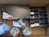 a cardboard box with a bunch of electronics inside of it