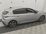 a picture of a silver car parked in a garage