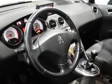 a steering wheel and dashboard of a small car