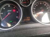 a close up of a speedometer and gauges on a car