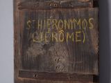 a wooden box that has some writing on it