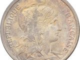 an old coin with the image of a woman on it