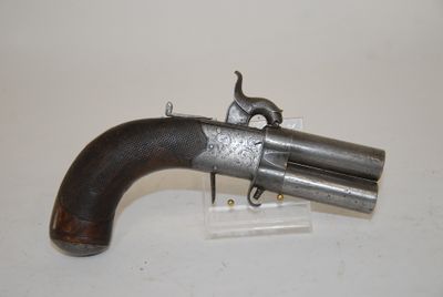 an old gun that is on display on a table