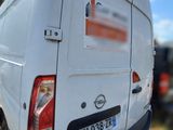 a white van that is parked on the side of the road