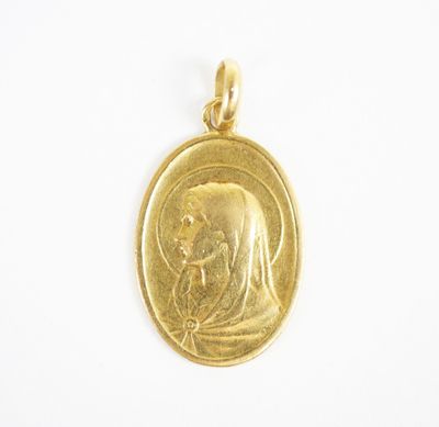 a gold coin with an image of a woman and child on it