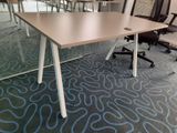 tables and chairs in a room with a carpeted floor