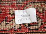 a piece of paper that has been pinned to a rug