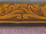 an image of a close up of a piece of wood with a design on it