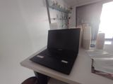 a laptop computer sitting on top of a white desk
