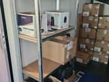 many boxes and boxes on the shelves in the room