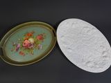 two plates that have flowers on them on a table