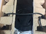 a cardboard box with a black object inside of it