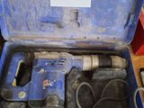 a blue tool box with tools in it on a table