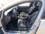 the interior of a car with the door open and the driver ' s seat down