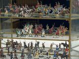 many figurines in a glass case on display