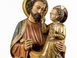 statue of jesus holding a child in his arms