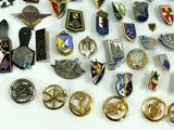 many different types of badges on a white surface