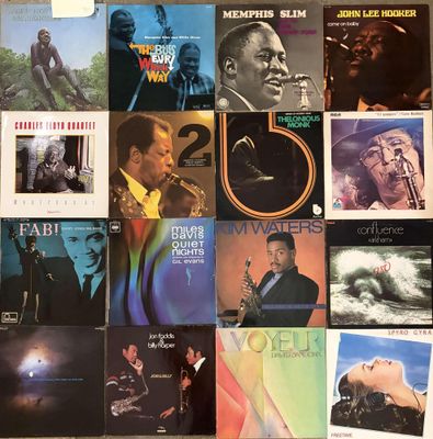 a lot of records on the wall of a room