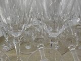 many wine glasses sitting on a tray on a table