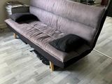 a couch that is sitting in the middle of a room