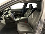 the interior of a car with the door open and the driver ' s seat down