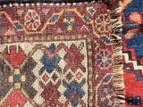 close up of a red, blue, and green oriental rug