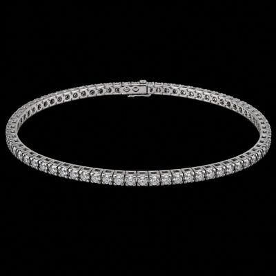 a diamond tennis bracelet on a black background