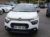 a white citrole parked in a parking lot