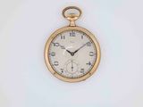 a gold pocket watch with roman numerals on the face