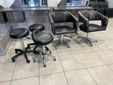 three chairs and a stool in a hair salon