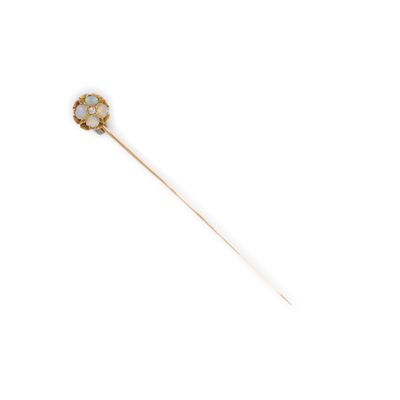 l'image d'un bâton orné d'une fleur, sur fond blanc