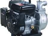 une pompe à eau noire et argentée posée sur un support