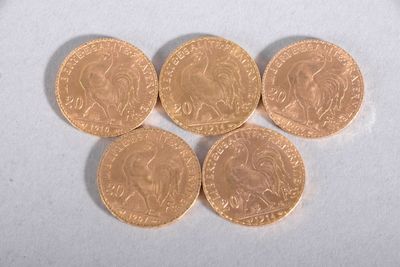 six british pound coins sitting on top of each other on a white surface