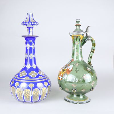 three different colored vases sitting next to each other on a white surface