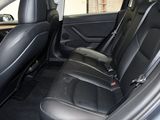 the back seats of a car are black in color
