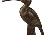 bronze sculpture of a bird on a stand