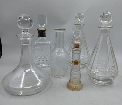 a lot of glass bottles that are sitting on a table