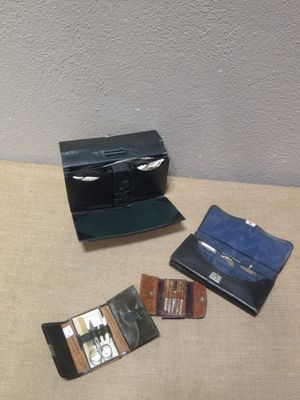 three wallets sitting on a table next to each other