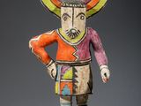 une image représentant une figurine d'un homme portant un chapeau sur la tête