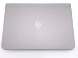 a laptop that is sitting on a white surface