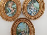 three framed pictures of a woman and a child in a landscape