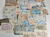 a pile of old money sitting on top of a table