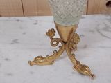 a glass vase that is sitting on a table