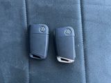 two volkswagen key covers in the back seat of a car
