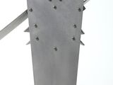 a close up of a metal object on a white surface