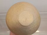 a person holding a large ball in their hand