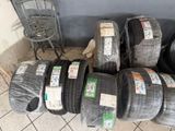 a lot of tires that are stacked up on the floor