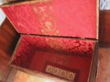 a red and gold box sitting on the floor
