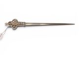 an antique silver plated dagger on a white background