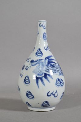 a blue and white vase with a bird design on it